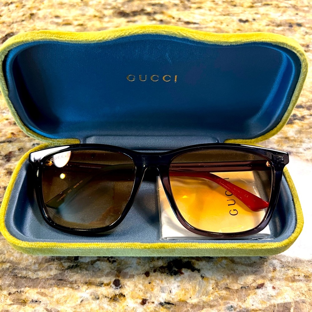 Gucci sunglasses never worn. Comes with case and bag